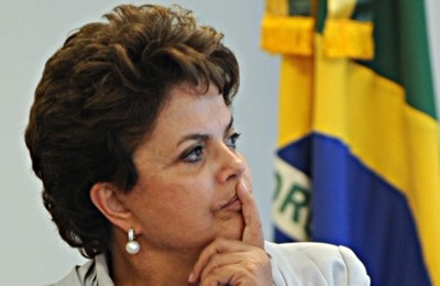  Dilma e Lupi: parece que a questão é saber quem tem a bala maior…